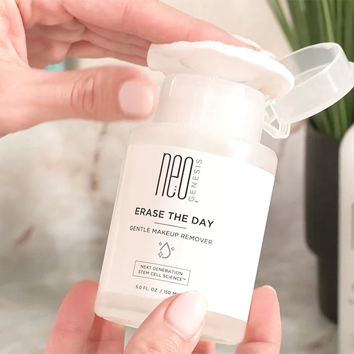 NeoGenesis Erase The Day Makeup Remover Being Dispensed Onto Cotton Pad