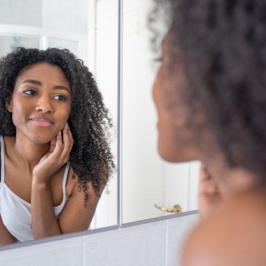 Woman looking in mirror