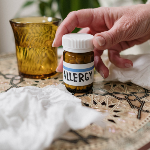 Someone grabbing allergy medication