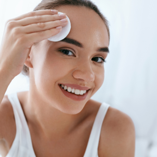 Woman cleaning face