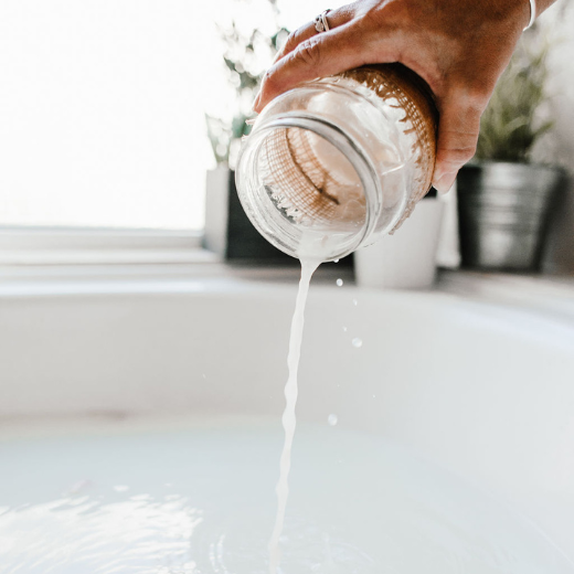 Pouring Bubble Bath into Bathtub