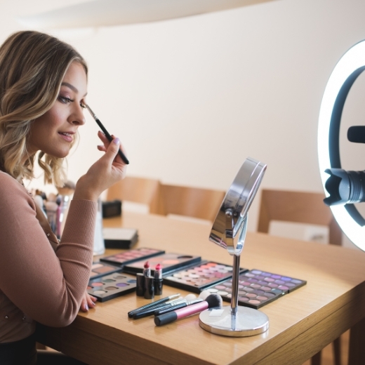 Woman applying eye makeup