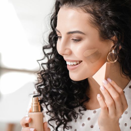 Woman applying makeup