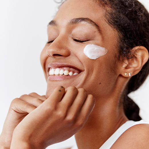 Woman with Fresh Rose Deep Hydration Face Cream on Cheek