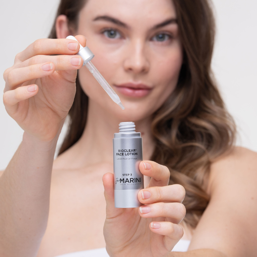 Model Holding Jan Marini Bioclear Face Lotion