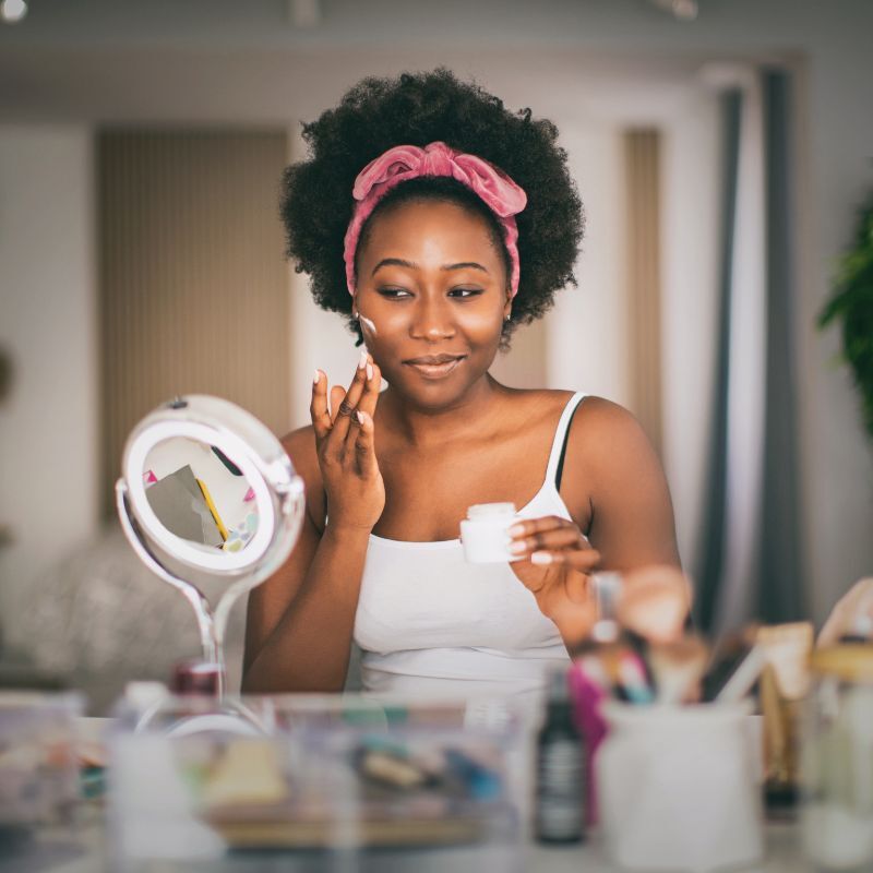 Woman cleaning her face in the morning.