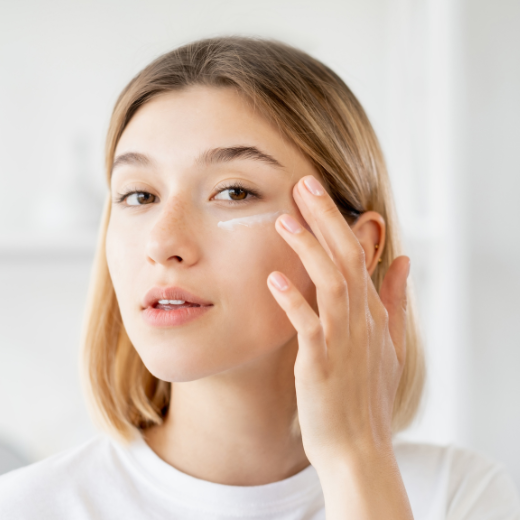 Woman applying soothing skin care