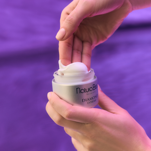 Image of hand model applying Natura Bissé Diamond Extreme Cream