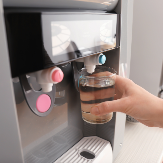 Dispensing drinking water from office water cooler during work day