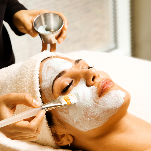 Woman receiving a facial treatment at a spa