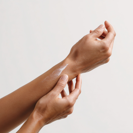 Image of hand model applying a cleanser to their arm
