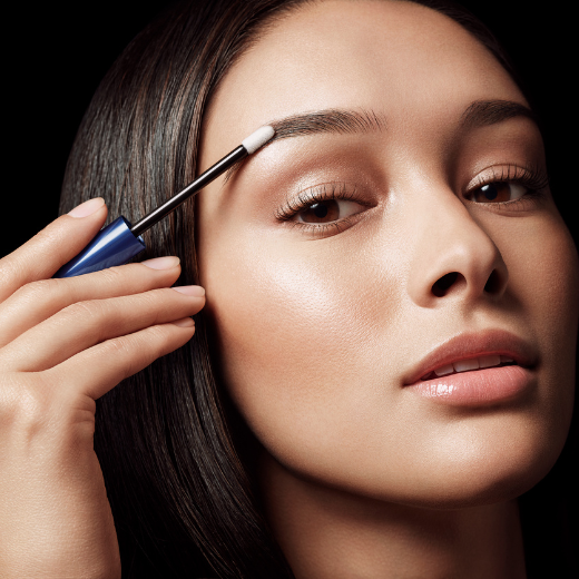 Woman Applying RevitaBrow Advanced Eyebrow Conditioner