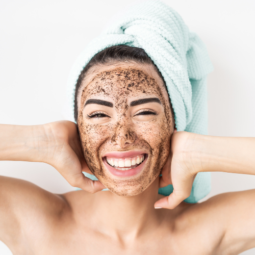 Woman posing with skin care mask applied to her face