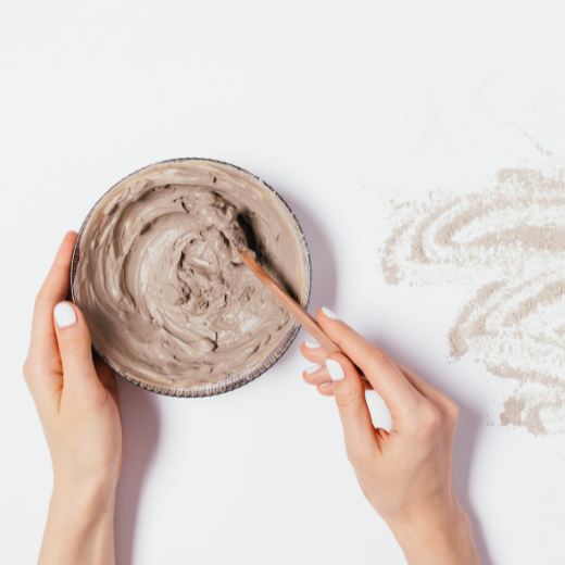 Mixing a homemade skin care face mask in a bowl