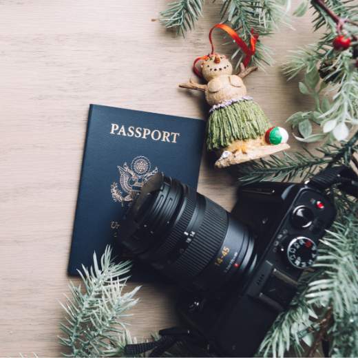 Travel items including passport and camera necessary to travel during the Holiday season