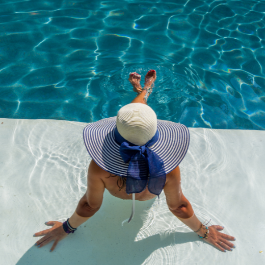 Woman Relaxing In The Pool