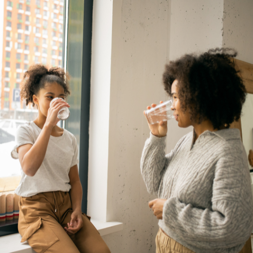 Mother and Daughter drinking water together